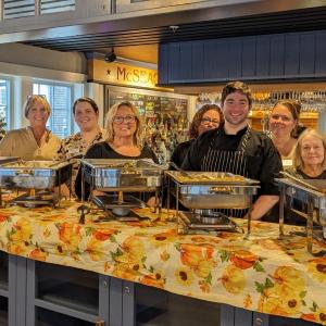 CRC board members and staff, and Chef Jacob Dushuttle, serve free Thanksgiving meals at McSeagulls. CANDI JONETH/Boothbay Register