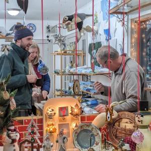 Steve Madden of Mung Bean helps customers with holiday shopping. CANDI JONETH/Boothbay Register