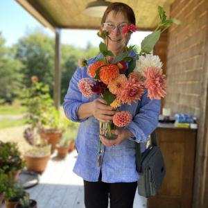 Irene Marchenay with a Veggies to Table bouquet. Erica Berman photo