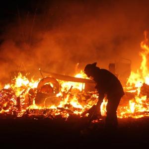 A FIREFIGHTER at the scene of the Nov. 19 blaze that destroyed Squirrel Island’s maintenance building. STEVE EDWARDS/Boothbay Register