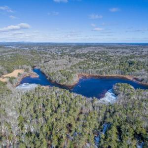 An aerial view of the Pemaquid River south of Biscay Pond, with Keyes Woods Preserve in the foreground. Courtesy of Coastal Rivers