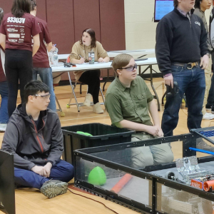 From left, Zander Blake, Afton Warren-Burdin and Kolton Campbell wait for a match to begin during the VEX competition in Monmouth on Saturday, Feb. 3. Courtesy photo