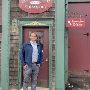 Nicholas Plumer in front of Boothbay Region Surveyors in Boothbay. FRITZ FREUDENBERGER/Boothbay Register
