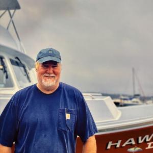 Matt Sledge stands beside the 46-foot lobster boat he built. Courtesy photo