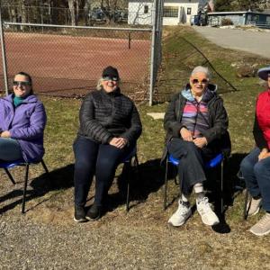 BHYC staff and members admire the solar eclipse from the tennis courts parking lot. Pictured from left are Office Manager Andrea Perkins, Secretary Sandi Hakanson, and members Abby Smith and Janet Bruehl. Courtesy of Eric Hakanson