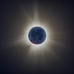 “This ‘Earthshine’ shot is one I have been planning for more than a year. It is made up of nearly 14 images to capture the solar winds, the prominences around the disc and the moon surface. The blue cast comes from the earth being the reflector to light the surface of the moon. The earth is mostly blue which is why the moon surface looks bluish in this scene taken at totality. This was not an easy shot to get and I am happy with my first attempt at Earthshine.” – Michael Leonard
Mike Leonard