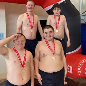 A gold medal-winning relay team. From left,back row: Peter Brewster and Anthony Angelico; front: Danny Miller and Vincent Giles. Courtesy of Toby LeConte