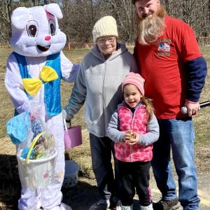 From left, Titan Lewis as the Easter Bunny, Darlene Little, Madison Little (the winner of the golden egg in the five and under category), and event emcee, Darrell Gudroe. Courtesy of Eve Jamieson