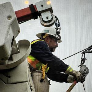 Line workers restore power on the peninsula. Courtesy of CMP