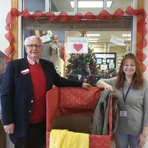 Shawn Lewin and Jen Field stand next to a Community Center coat collection box filled with clothing destined for Portland’s asylum seekers in 2019. File photo