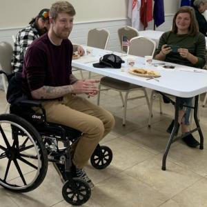 Veteran Christopher George celebrates his 31st birthday May 4 by receiving a $9,000 community contribution and a quilt. George was injured in car accident in February. He served four years in the Army and now works at Fuller Marine. Also pictured: Bree George, his wife. BILL PEARSON/Boothbay Register