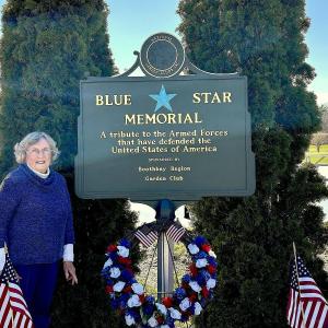 Linda Redman, Maine’s Blue Star Marker chair since 2007, beside the Boothbay Harbor marker on Townsend Avenue. JENNY BENNETT/Boothbay Register