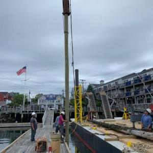 Workers from Fuller Marine Services set up new pilings to be driven in at the Boothbay Harbor Public Landing. Rob Leavitt photo