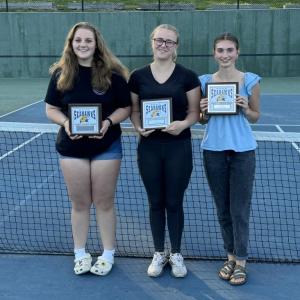The Boothbay Region High School girls tennis team held its awards ceremony outside on the tennis courts on Tuesday, June 11 and these players received post-season plaques. From left are Ivory Cody, Coach’s Award; Hannah Kreft, Most Improved Player; and Laura Chapman, Most Valuable Player. Courtesy of Alex Arsenault