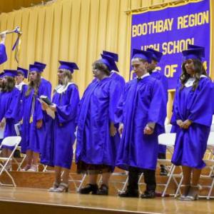 BRHS Class of 2024 grand marshal Finn Harkins signals his classmates to get ready to depart the stage following the Awards Night ceremony. FRITZ FREUDENBERGER/Boothbay Register