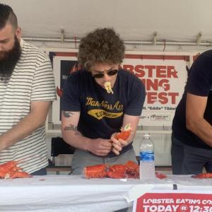 Contestants compete June 26 in the Windjammer Days lobster eating contest. Craig Browning of Newcastle, Australia, right, won in 100 seconds. BILL PEARSON/Boothbay Register