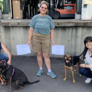 The first graduates of a dog training course at Boothbay Craft Brewery are, from left, BB with her owner Sarah Rhinelander, trainer Ann Walko, and Zissou with Amanda Maddalone. BILL PEARSON/Boothbay Register
