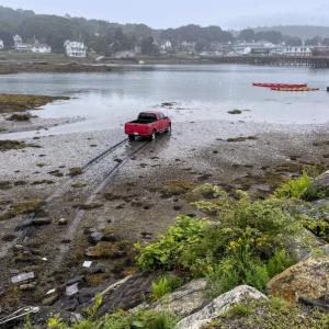 A truck ended up in the inner Boothbay Harbor in what appeared to be an accident Monday. FRITZ FREUDENBERGER/Boothbay Register