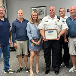 Boothbay EMS Chief Dan Gardner accepts the Spirit of America award from the Boothbay Harbor Board of Selectmen. Pictured, from left, are Michael Tomko, Mark Osborn, Alyssa Allen, Gardner, Ken Rayle and Mark Gimbel. Julia Latter photo