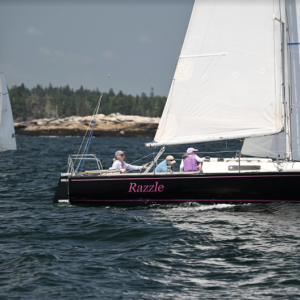 Commodore Anne Grimes Rand at the helm of Razzle during the Round Southport Race. Courtesy of Dave Smith