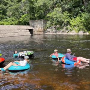 Tubers drift down the river during the 2023 Sheepscot River Knotweed Float. Courtesy of Midcoast Conservancy
