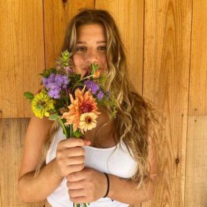 Natalie from the Forman School Ingenuity Gap year program with flowers. Courtesy photo