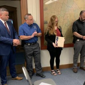 Boothbay Region Ambulance Service Director Dan Gardner officially thanks Lincoln County first responders Aug. 20 for their assistance in saving a 5-year-old boy’s life last month. Pictured, from right, Gardner, Sgt. Scott Hayden, Rhiannon Hersey, dispatcher; Mark Fortin, deputy; Det. Jared Mitkus, LCSO; and Rob Bickford, communications deputy director. BILL PEARSON/Boothbay Register