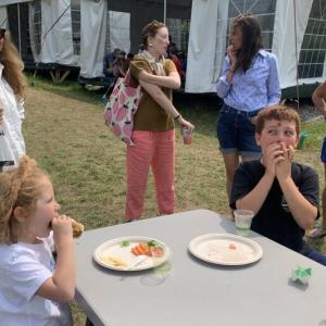 Frankie Moran, 5, and Paxton Turpin, 8, right, enjoy a hot dog Aug. 16 at Boothbay Sea and Science Center’s Aug. 16 “Last Day of Camp” barbecue. BILL PEARSON/Boothbay Register