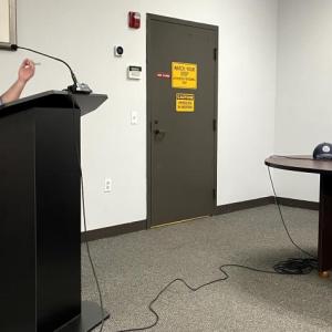 A woman talks to the town board