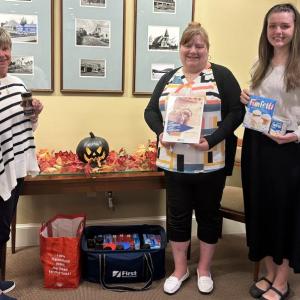 First National Bank collecting items from the Sugar and Spice Drive. Courtesy of First National Bank Collecting spices