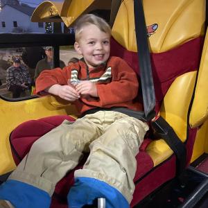 A child in the Wienermobile 