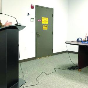 A woman talks to the town board