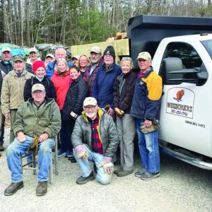 The Woodchucks and others gather around the Woodchucks' new truck on Saturday, Nov. 16. SARAH MORLEY/Boothbay Register Woodchucks