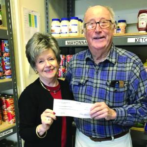 Fleet Davies accepts a $1,295 check on behalf of the Boothbay Region Food Pantry from Sarah Seepe of the Boothbay Region Mah Jongg group. William Seepe photo Fleet Davies accepts a $1,295 check on behalf of the Boothbay Region Food Pantry from Sarah Seepe of the Boothbay Region Mah Jongg group. William Seepe photo