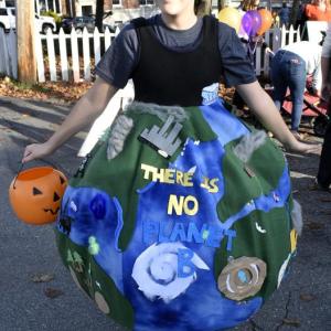 Scout Martin, 13, sends a message with her costume "The Earth ravaged by climate change." FRITZ FREUDENBERGER/Boothbay Register