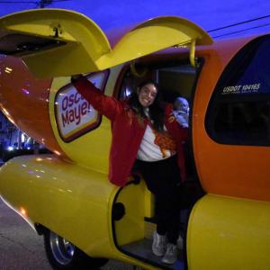 The Wienermobile and one of the drivers