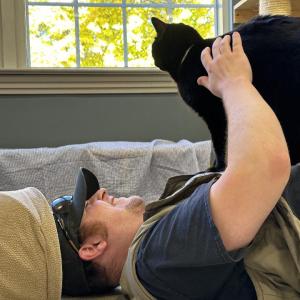 Eric Hutchinson helping to socialize a cat at Mid Coast Humane in Brunswick. ECB photo