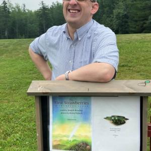Matt Brough with one of the Story Walk Houses Mobius built and installed at Medomak Valley High School.