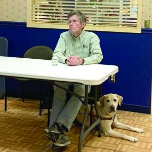 Jim Kutsch, former president of Seeing Eye Inc., and his dog, Easton, talk history of the first guide dog school in North America. ISABELLE CURTIS/Boothbay Register
