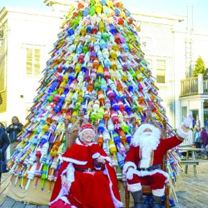 Mr. and Mrs. Claus under the pot buoy tree. FRITZ FREUDENBERGER/Boothbay Register