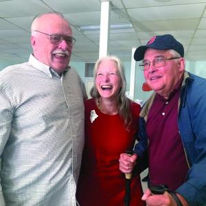 2025 Maine Teacher of the Year Becky Hallowell, who teaches fourth grade at Wiscasset Elementary School, is flanked by her uncles Michael “Jim” Bilinsky, left, and Daniel Fortin Oct. 10 at a reception after Hallowell learned she’d won the statewide honor. SUSAN JOHNS/Wiscasset Newspaper 