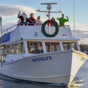 Santa and his entourage arriving by boat to Whale Park Dec. 7. FRITZ FREUDENBERGER/Boothbay Register