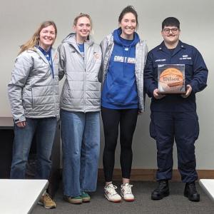 Team seniors honor Laroche-Albert with a signed basketball. CANDI JONETH/Boothbay Register