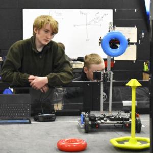 Jayden Orne test runs his team's robot on the practice field. ISABELLE CURTIS/Boothbay Register