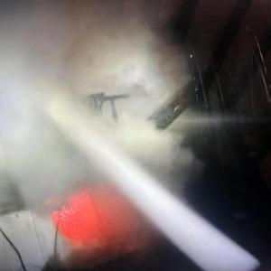 Fire attack teams deploying two attack hoses on the fire. Courtesy of Mark Sullivan