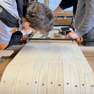 Great Salt Bay students put finishing touches on a white ash toboggan. Courtesy photo