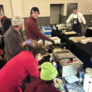 Lori Mitchell (in red) and the crew of Boothbay Craft Brewery whip together 400 lobster bites. Courtesy of Lori Mitchell