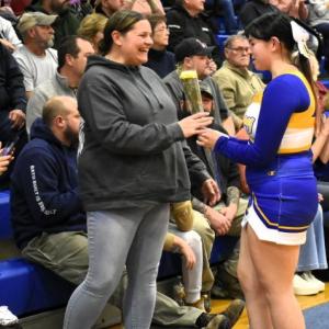 Skyla Carrier presents a carnation to her mother, Shannon Leeman, at the BRHS senior celebration Feb. 3. FRITZ FREUDENBERGER/Boothbay Register