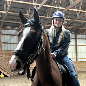 BRHS senior Harriet McKane rides atop Crash, the horse she helped break during her mentorship. Courtesy of Mary Miller