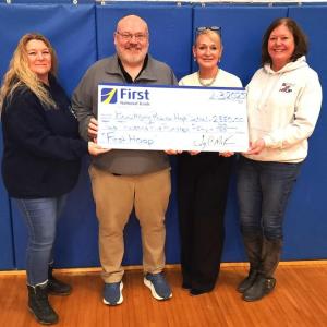First National Bank presenting Boothbay Region High School with a check for $2,550 from the First Hoop program. Courtesy photo